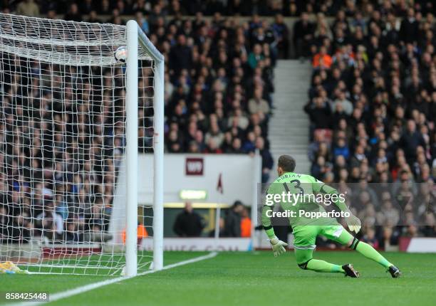 Adrian of West Ham concedes a goal by Wayne Rooney of Manchester United during the Barclays Premier League match between West Ham United and...