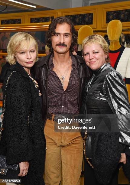 Flora Starkey, Ben Cobb and Jess Hallett attend the Dover Street Market open house on October 6, 2017 in London, England.