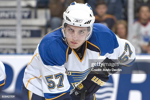 David Perron of the St. Louis Blues concentrates on the puck against the Edmonton Oilers at Rexall Place on March 17, 2009 in Edmonton, Alberta,...