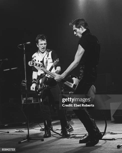 Photo of Paul SIMONON and CLASH and Joe STRUMMER, Paul Simonon and Joe Strummer performing live onstage