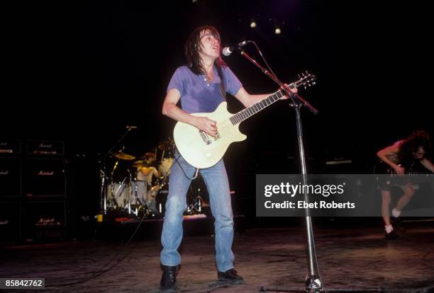 Photo of AC/DC and Simon WRIGHT and Malcolm YOUNG and AC DC; Simon Wright, Malcolm Young and Angus Young performing live onstage