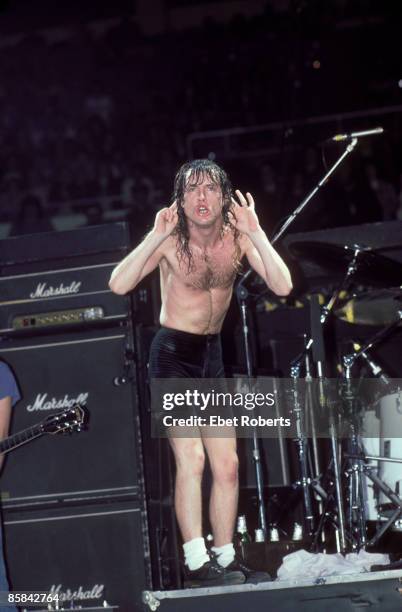 Photo of AC DC and Angus YOUNG and AC/DC; Angus Young performing live onstage