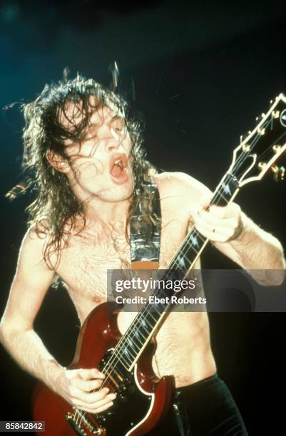 Photo of AC DC and Angus YOUNG and AC/DC; Angus Young performing live onstage, playing Gibson SG guitar