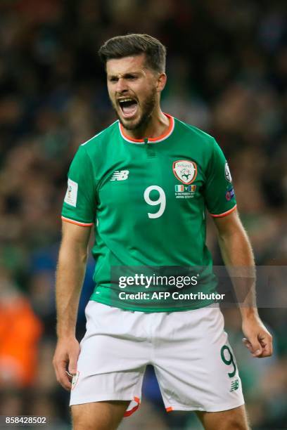 Republic of Ireland's striker Shane Long reacts after missing a chance during the FIFA World Cup 2018 qualification football match between Republic...