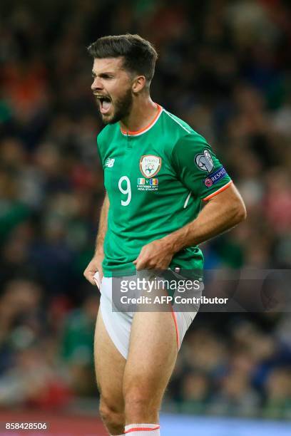 Republic of Ireland's striker Shane Long reacts after missing a chance during the FIFA World Cup 2018 qualification football match between Republic...