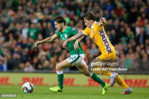 Republic of Ireland's midfielder Harry Arter takes on Moldovia's midfielder Eugen Cebotaru during the FIFA World Cup 2018 qualification football...