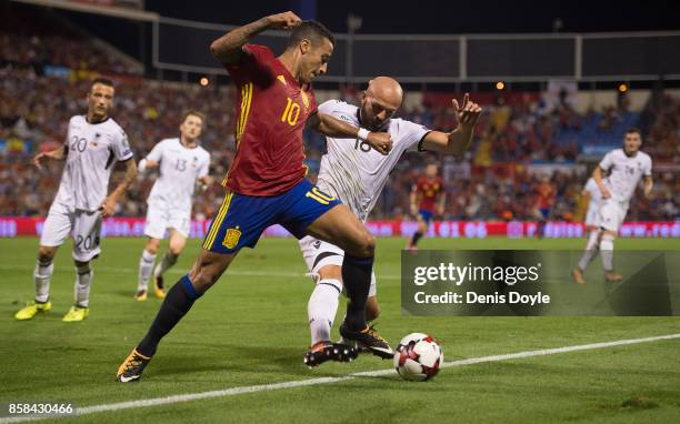 Tiago Alcantara of Spain is tackled by Arlind Ajeti of Albania during the FIFA 2018 World Cup Qualifier between Spain and Albania at Estadio Jose...