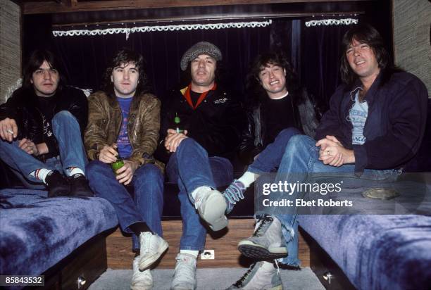 Photo of TOUR BUS and Malcolm YOUNG and Cliff WILLIAMS and Brian JOHNSON and Simon WRIGHT and Angus YOUNG and AC/DC and AC DC; L-R: Malcolm Young,...