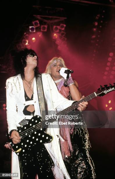Photo of Vince NEIL and Nikki SIXX and MOTLEY CRUE, Nikki Sixx & Vince Neil performing live on stage