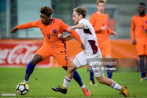 Steven Bergwijn of Jong Oranje, Karklins Kriss of Jong Letland during the EURO U21 2017 qualifying match between Netherlands U21 and Latvia U21 at...