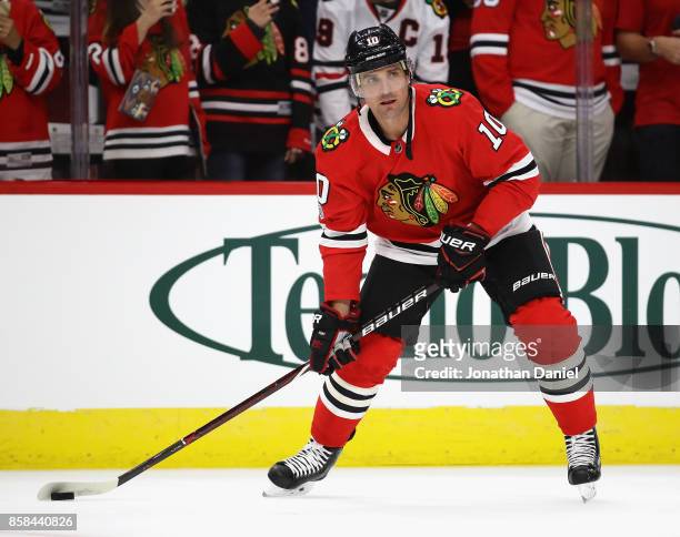 Patrick Sharp of the Chicago Blackhawks participates in warm-ups before the season opening game against the Pittsburgh Penguins at the United Center...