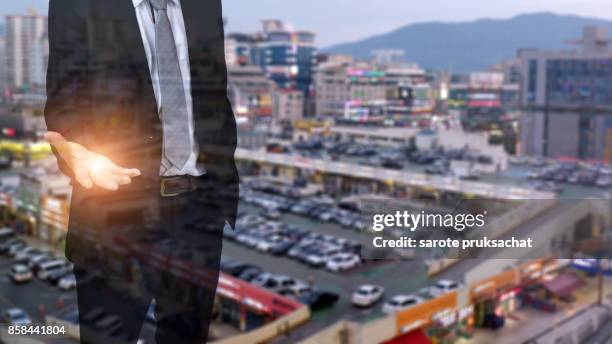 double exposure of businessmen with open hands ready to run a business and blurred city background .concept for business, finance . - man double exposure profit concept imagens e fotografias de stock