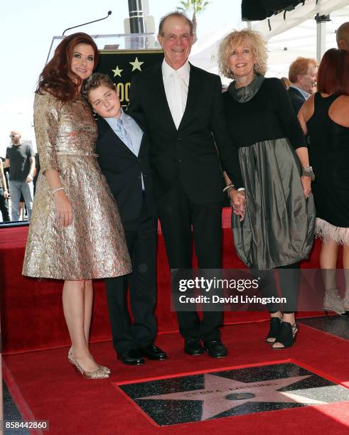 Actress Debra Messing, son Roman Walker Zelman, father Brian Messing and Karen Bye attend Debra Messing being honored with a Star on the Hollywood...