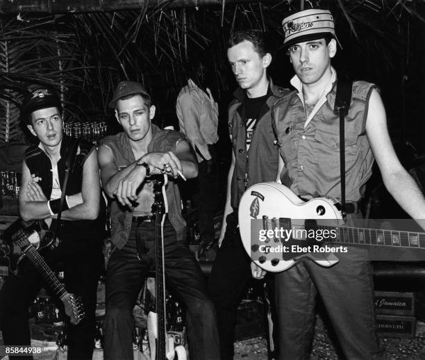 Paul SIMONON and Terry CHIMES and Joe STRUMMER and CLASH and Mick JONES; L-R: Joe Strummer, Paul Simonon, Terry Chimes, Mick Jones - posed, group shot