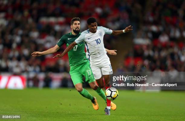 Marcus Rashford of England and Miha Mevlja of Slovenia during the FIFA 2018 World Cup Qualifier between England and Slovenia at Wembley Stadium on...
