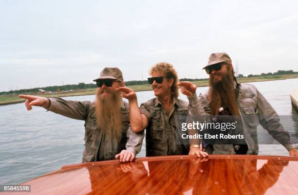 Photo of Frank BEARD and ZZ TOP and Dusty HILL and Billy GIBBONS; L-R: Dusty Hill, Frank Beard, Billy Gibbons - posed, group shot, on boat