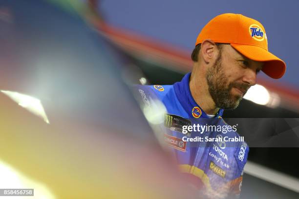 Matt Kenseth, driver of the Tide Pods Toyota, stands on the grid during qualifying for the Monster Energy NASCAR Cup Series Bank of America 500 at...