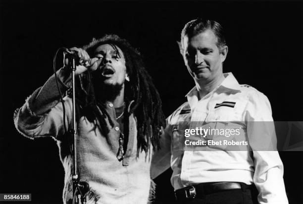 Photo of Edward SEAGA and WAILERS and Bob MARLEY; L-R: Bob Marley, Edward Seaga at the One love peace concert, National Stadium, Kingston
