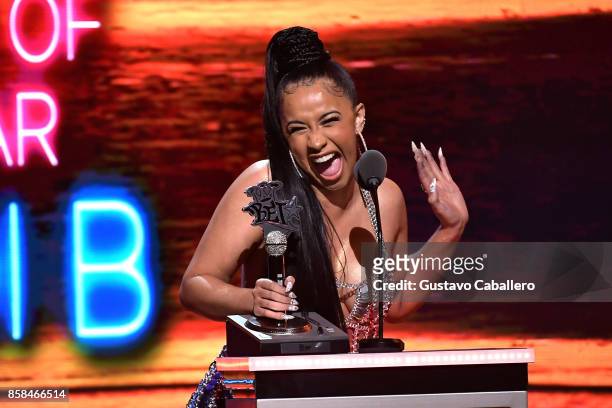 Rapper Cardi B accepts the award for 'Hustler of the Year' onstage during the BET Hip Hop Awards 2017 at The Fillmore Miami Beach at the Jackie...