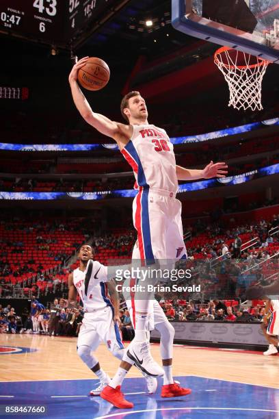 Jon Leuer of the Detroit Pistons grabs the rebound against the Atlanta Hawks on October 6, 2017 at Little Caesars Arena in Detroit, Michigan. NOTE TO...