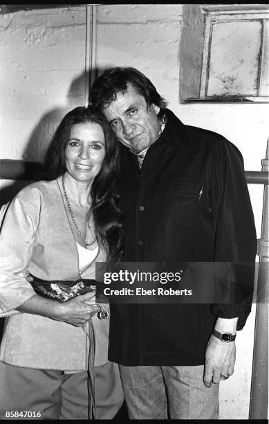 Photo of June CARTER and Johnny CASH; Portrait of Johnny Cash with wife June Carter Cash