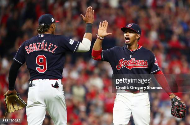 Francisco Lindor and Erik Gonzalez of the Cleveland Indians react after a call was overturned in the eleventh inning against the New York Yankees...