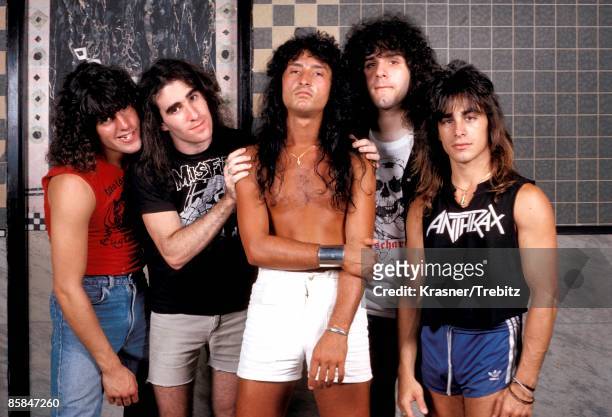 Photo of ANTHRAX; Joey Belladonna is in the middle
