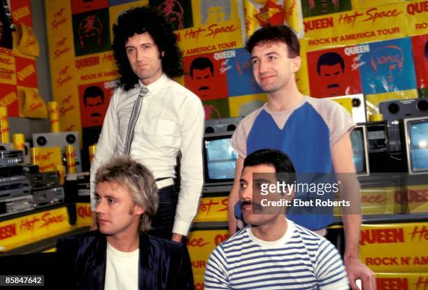 Photo of QUEEN; Back, Brian May and John Deacon, Front, Roger Taylor and Freddie Mercury, posed group portrait