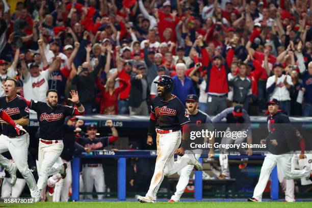 Austin Jackson runs home to score the winning run on a single by Yan Gomes of the Cleveland Indians to win the game 9 to 8 in the 13th inning during...