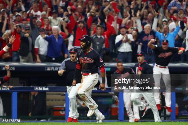Austin Jackson runs home to score the winning run on a single by Yan Gomes of the Cleveland Indians to win the game 9 to 8 in the 13th inning during...