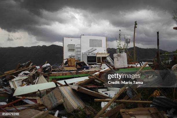 The remnants of a destroyed home stand more than two weeks after Hurricane Maria hit the island on October 6, 2017 in Morovis, Puerto Rico. Less than...