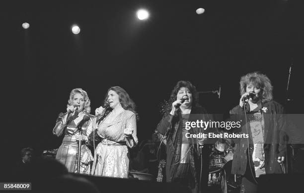 Photo of CARTER FAMILY and June CARTER; L-R Carlene Carter, June Carter Cash, Anita Carter and Helen Carter performing on stage