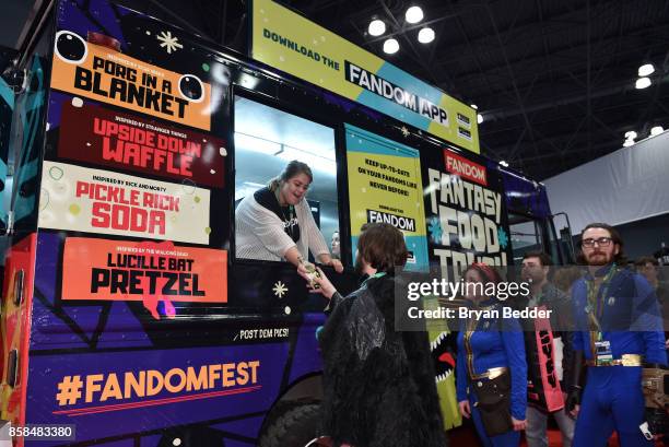 Guests receive complimentary snacks at the FANDOM Fest during New York Comic Con on October 6, 2017 in New York City.