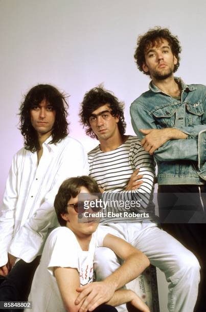 Bill BERRY and Michael STIPE and Peter BUCK and Mike MILLS and REM; L-R: Peter Buck, Mike Mills , Bill Berry, Michael Stipe - posed, studio, group...