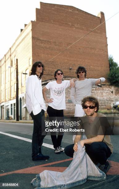Bill BERRY and Michael STIPE and Peter BUCK and Mike MILLS and REM; L-R : Peter Buck, Mike Mills, Bill Berry; : Michael Stipe - posed, group shot