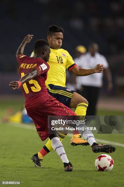 Juan Vidal of Columbia and Gideon Mensah battle for the ball during the FIFA U-17 World Cup India 2017 group A match between Colombia and Ghana at...