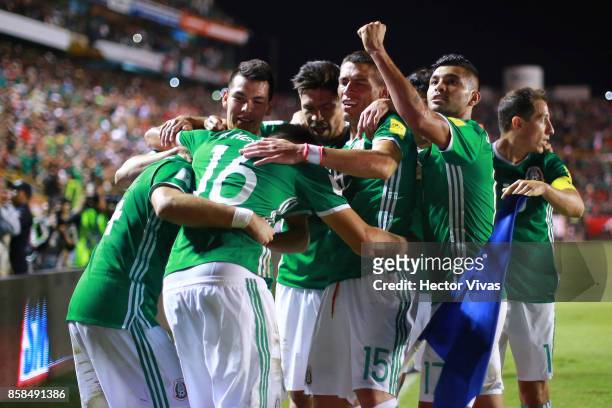 Javier Hernandez of Mexico celebrates with teammates after scoring the second goal of his team during the match between Mexico and Trinidad & Tobago...