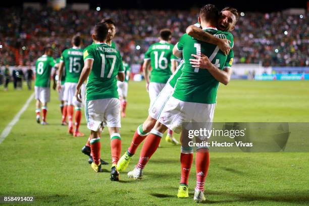 Javier Hernandez of Mexico celebrates with teammates after scoring the second goal of his team during the match between Mexico and Trinidad & Tobago...