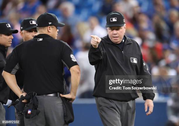 First base umpire and crew chief Brian Gorman signals a call during the Toronto Blue Jays MLB game against the Baltimore Orioles at Rogers Centre on...