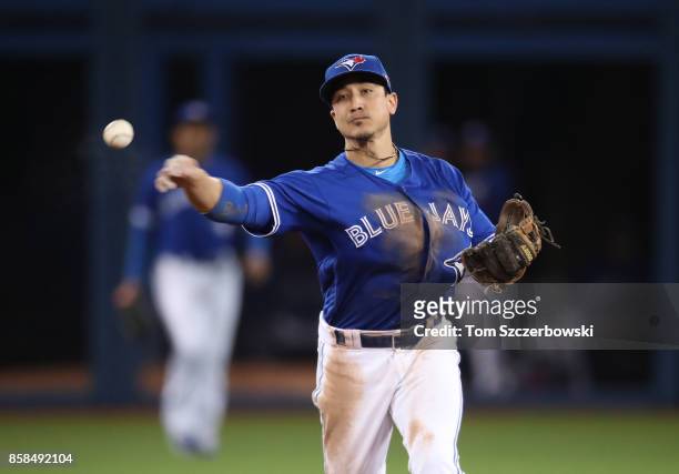 Darwin Barney of the Toronto Blue Jays makes the play and throws out the baserunner in the fifth inning during MLB game action against the Baltimore...