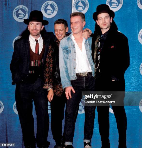 Photo of U2, L-R: The Edge, Adam Clayton, Larry Mullen Jnr, Bono, posed, group shot