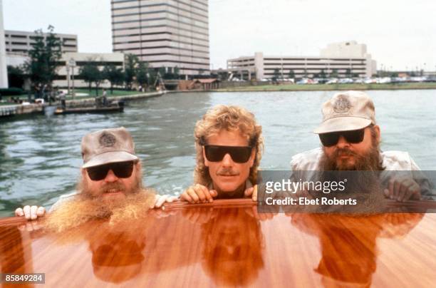 Photo of Billy GIBBONS and ZZ TOP and Frank BEARD and Dusty HILL; L-R: Dusty Hill, Frank Beard, Billy Gibbons - posed, group shot, on boat