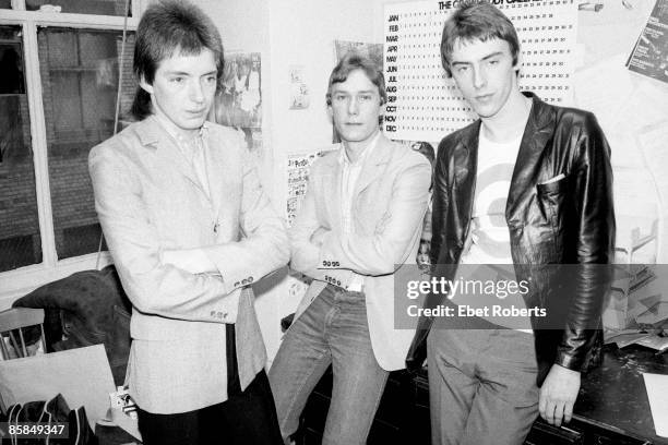 Bruce Foxton, Rick Buckler, Paul Weller posed, group shot in office, New York, March 1978.