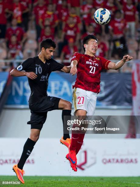 Guangzhou Evergrande midfielder Zheng Long fights for the ball with Seongnam FC midfielder Jorge De Moura Xavier during the AFC Champions League 2015...