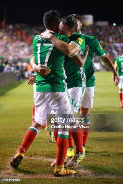 Javier Hernandez of Mexico celebrates with teammates after scoring the second goal of his team during the match between Mexico and Trinidad & Tobago...