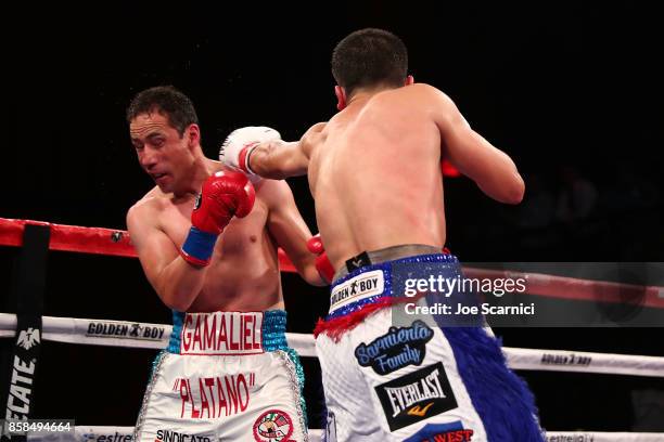 Christian Gonzalez throws a punch at Gamaliel Diaz in the sixth round during their Super Lightweight fight at Belasco Theatre on October 6, 2017 in...