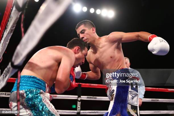 Christian Gonzalez throws a punch at Gamaliel Diaz in the sixth round during their Super Lightweight fight at Belasco Theatre on October 6, 2017 in...