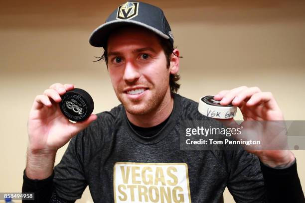 James Neal of the Vegas Golden Knights displays the two pucks used while scoring the first two goals in team history against the Dallas Stars at...