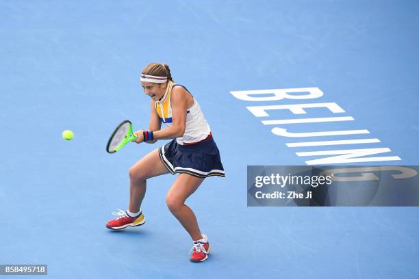 Jelena Ostapenko of Latvia returns a shot against Sorana Cirstea of Romania during the Women's Quarter finals match on day seven of the 2017 China...