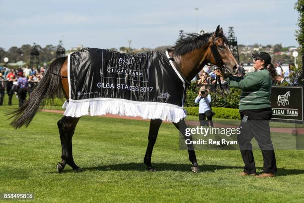 Keen Array with strapper Jess Carmichael after winning the Gilgai Stakes at Flemington Racecourse on October 07, 2017 in Flemington, Australia.